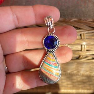 A genuine Calsilica stone with sapphire gemstone around sterling silver 925